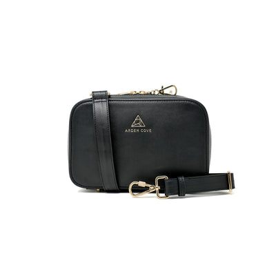 Anti-theft Water-resistant Travel Crossbody - Elise Crossbody in Black Gold with slash-resistant wide faux leather & locking clasps straps - front view - Arden Cove