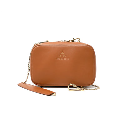 Anti-theft Water-resistant Travel Crossbody - Elise Crossbody in Brown Gold with slash-resistant chain & locking clasps straps - front view - Arden Cove
