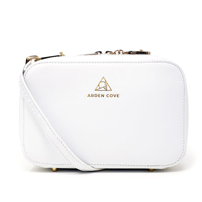 Anti-theft Water-resistant Travel Crossbody - Elise Crossbody in White Gold with slash-resistant faux leather & locking clasps straps - front view - Arden Cove