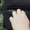 Anti-theft Carmel backpack with RFID-blocking. Demonstration of the RFID-blocking built in wallet with 8 card slots and bill pocket