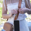 phone tether can attach to strap, purse, or pant loop