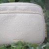 Anti-theft Water-resistant Verona Crossbody demonstrating water-resistance with water droplets falling down the bag