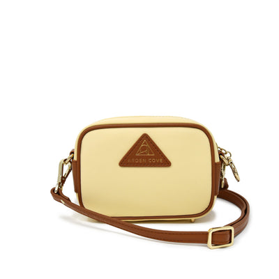 Anti-theft Water-resistant Travel Crossbody - Crissy Mini Crossbody in Cream Gold with slash-resistant faux leather & classic clasps straps - front view - Arden Cove