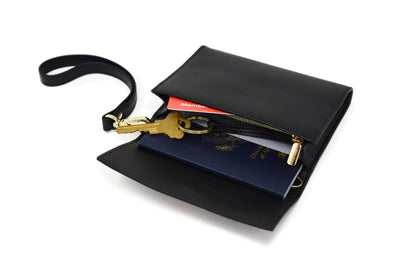 Kelso RFID-blocking Passport Pouch Black Gold Modeled with keys, card, passport