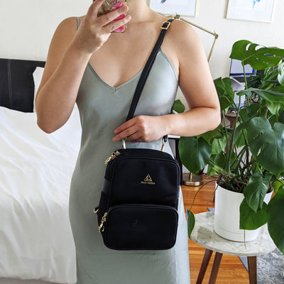 Slash Resistant Faux Leather Strap in Black Gold, modeled with Carmel Backpack as a crossbody Side View