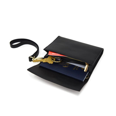 Faux Leather Wrist Strap in Black Gold Modeled with Kelso Passport Pouch